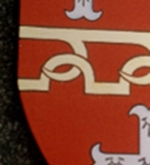 detail of gilded heraldic shield on metal
